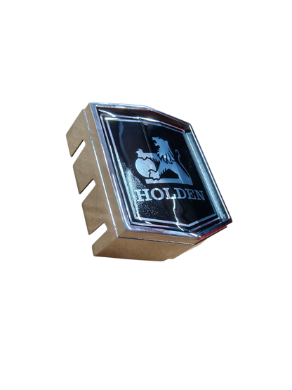 HOLDEN HJ - Hx Kingswood Belmont Grille Emblem Cast Housing and insert Badge NEW